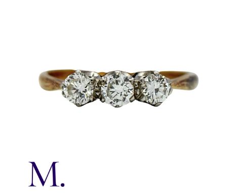 A 3-Stone Diamond Ring in yellow gold and platinum.  Set with three round brilliant cut diamonds weighing approximately 0.45c