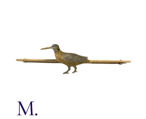 An Enamel Bird Stick Pin in 15k yellow gold, comprising a three colour gold bird on a bar, with yellow, black and white ename