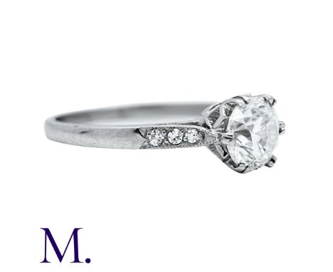 A Diamond Ring in white gold, set with a round brilliant cut diamond to the centre weighing approximately 0.95ct with accent 