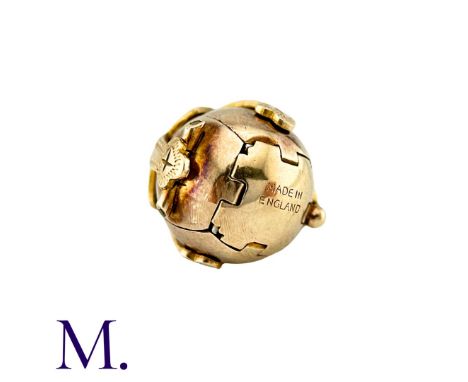 A Masonic Orb Pendant in 9k yellow gold and silver, the hinged spherical body opens to display a cross formed of six individu