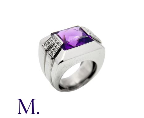 VERSACE. An Amethyst and Diamond Ring in 18K white gold, set with a large fancy faceted-rectangular amethyst with diamond-set