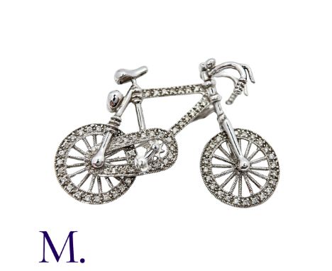 A Diamond Bicycle Brooch in 18K white gold, set with approximately 0.70ct of diamonds, with moving wheels, handlebars and ped