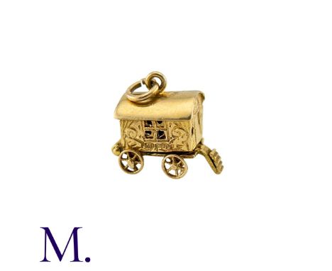 A Group of Gold Charms including a wagon, a camel, a handbag, a water carrier, a boot and a cross.Size: VariousWeight: 9.8g 