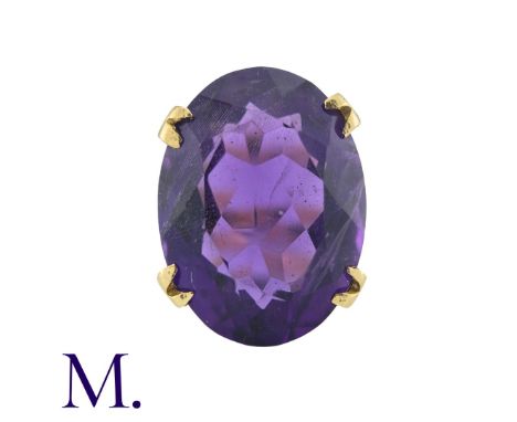 A Large Amethyst Ring in yellow gold, set with an oval cut amethyst weighing approximately 12.5ct.  Size: MWeight: 6.9g 