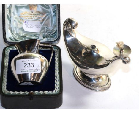 An Edwardian silver table cigar lighter in the form of a Roman lamp, Birmingham, 1910 (missing finial) with a cased Victorian