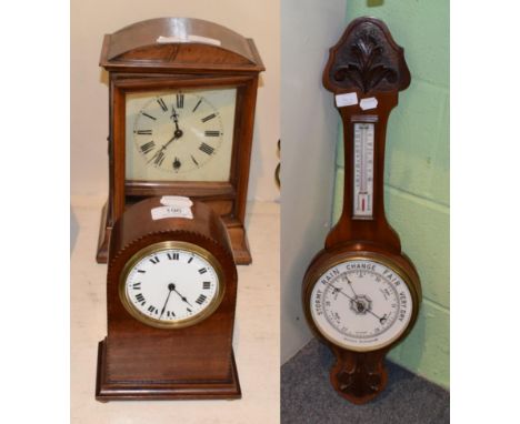 ^ A late 19th century walnut mantel timepiece; an Edwardian dome top mantel timepiece; and a Victorian mahogany barometer (3)