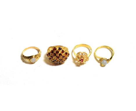 A 9 carat gold garnet cluster ring, finger size M1/2; a stone set ring, unmarked, finger size O; a floral motif ring stamped 