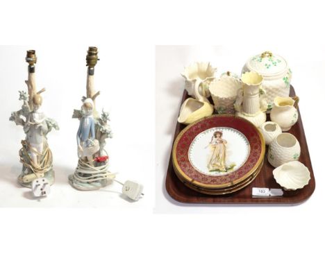 A collection of Beleek objects and two Lladro lamp bases