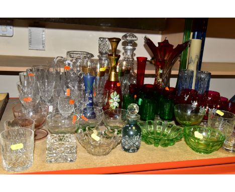 A QUANTITY OF COLOURED GLASS, comprising a red Venetian glass ashtray in the form of a gondola, two cut glass decanters, six 