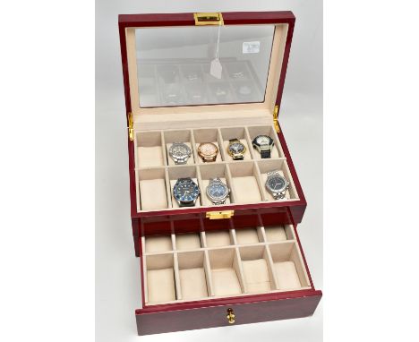 A WOODEN WATCH DISPLAY BOX WITH WATCHES, hinged top with viewing glass, also a pull out draw, compartments with cushions for 