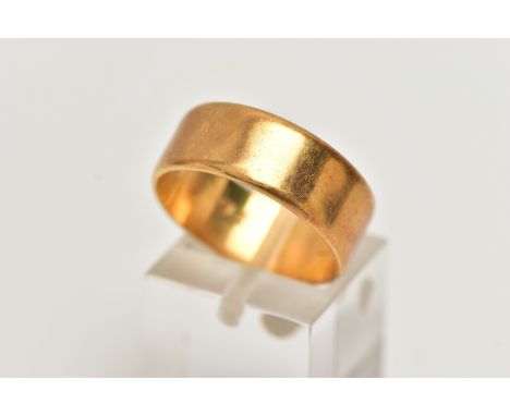 A WIDE FLAT BAND RING, stamped 18ct, personal date inscription to the inner band '26/3/77,' ring size R, width 7mm, approxima
