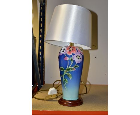 A FRANZ PORCELAIN 'PANSY' FZO0285 table lamp, decorated with multi coloured pansies on a blue and green ground on a circular 