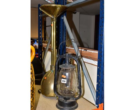 A HURRICANE LAMP AND A BRASS CANDLE HOLDER,  comprising a large brass candlestick of sculptural form, height approximately 70