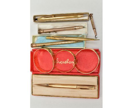 THREE BANGLES AND SIX PROPELLING PENCILS, two rolled gold, floral hinged bangles, each stamped 9ct R.G, a thin diamond textur