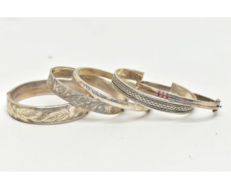 AN ASSORTMENT OF SILVER AND WHITE METAL BANGLES,  to include a hinged bangle with floral engraving and outer hallmark detail,