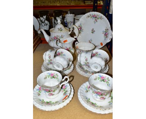 A TWENTY TWO PIECE ROYAL ALBERT 'MOSS ROSE' PATTERN TEA SET, comprising a teapot (small firing crack to inside of teapot), a 