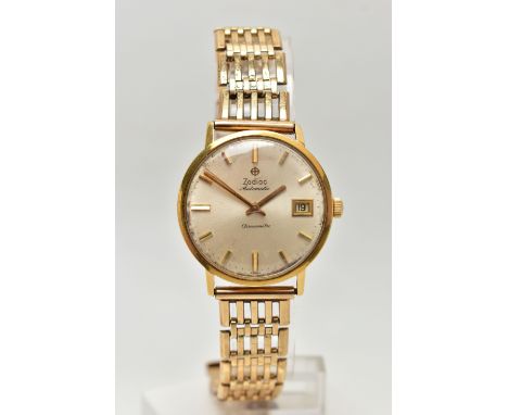 A 9CT GOLD ZODIAC AUTOMATIC CHRONOMETRE WRISTWATCH, the circular face with baton hour markers and date dial, to the gate brac