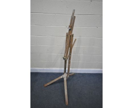 A FOLDING BEECH ARTISTS EASEL (condition:-paint splashes throughout)