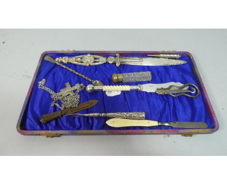 A Collection of Curios to Include Silver Plated Letter Opener, Butter Knife, Manicure Tools, Button Hook, Crucifix etc 