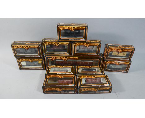 A Collection of Twelve Boxed OO Gauge Mainline to include 37-133 Steel Mineral Wagon, 37-138 Ventilated Van AllSopp's Lager, 