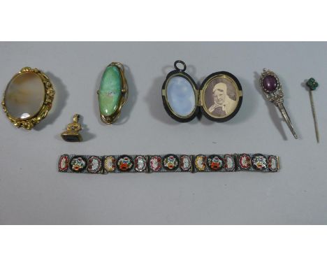 An Italian Micro Mosaic Brooch, Two Victorian Pinchbeck Agate and Ceramic Brooches and a Victorian Jet Mourning Locket 