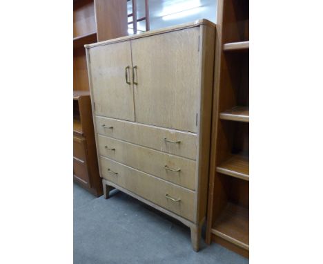 A Lebus light oak tallboy 