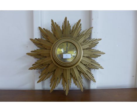 A Metamec Electric gilt sunburst wall clock 