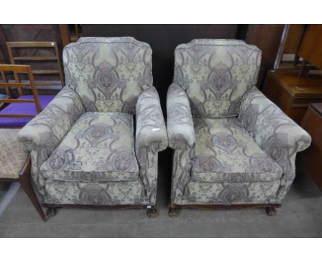 A pair of early 20th Century Chippendale Revival carved mahogany and fabric upholstered armchairs 