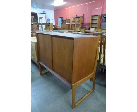 A Danish teak two door side cabinet 