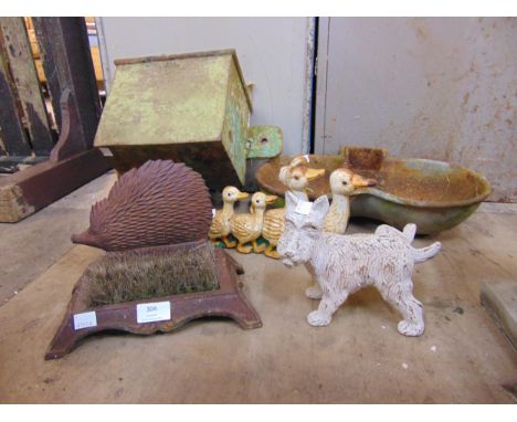A cast iron drain hopper, a pig water feeder, boot scraper, etc.
