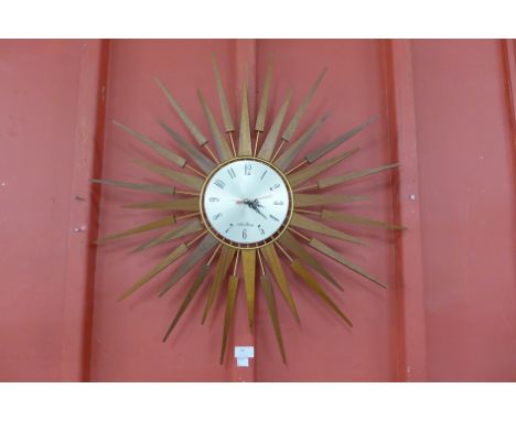 A Seth Thomas teak sunburst wall clock 