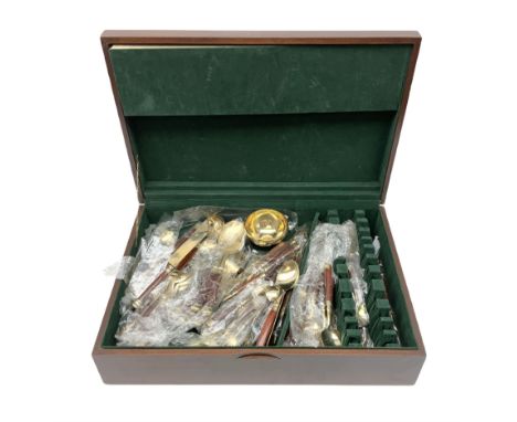 Thai canteen of cutlery, gilt with wood handles, the interior lined with green velvet