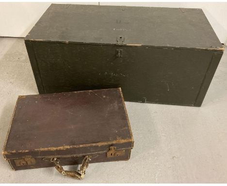 A painted metal banded wooden US military storage box with carry handles. Together with a small vintage leather suitcase.  Bo