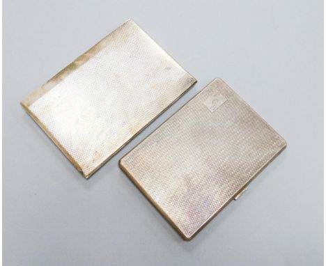 Two George V engine turned silver cigarette cases, largest 12.4cm, gross 12.5oz.