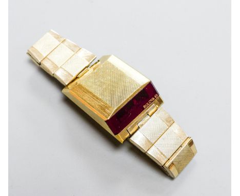 A gentleman's steel and gilt base metal Bulova digital wrist watch, on Bulova bracelet, case diameter 30mm (a.f.).