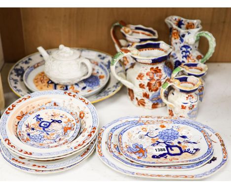 Nine pieces of Victorian Masons Ironstone, five Hydra jugs, a Delft charger and relief moulded teapot.