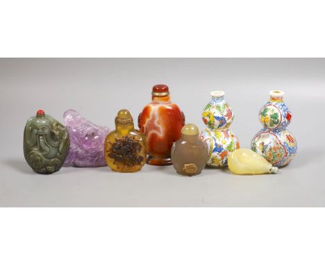 A group of Chinese jade, hardstone and glass snuff bottles, tallest 9.5 cm
