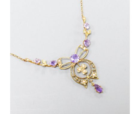 An Edwardian 9ct, amethyst and seed pearl set drop pendant necklace, 44cm,gross weight 4.3 grams.
