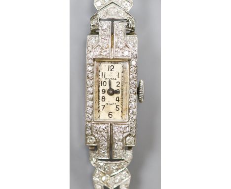 A white metal (stamped All platinum) and diamond set manual wind cocktail watch, on a 9ct white metal mesh bracelet, gross we