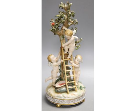 A German porcelain Meissen style group of amorini, climbing a ladder to pick fruit from a tree, small losses,27cm