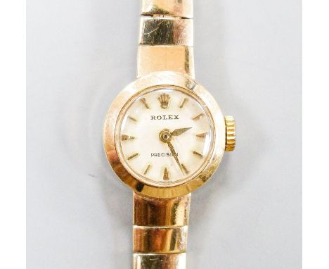 A lady's 9ct gold Rolex manual wind wrist watch on 9ct gold strap, case diameter 15mm,gross weight 14.8 grams.