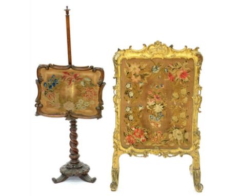 A VICTORIAN GILTWOOD AND COMPOSITION FIRESCREEN, WITH NEEDLEWORK PANEL, 94 X 60CM AND A VICTORIAN ROSEWOOD POLE SCREEN ON SPI