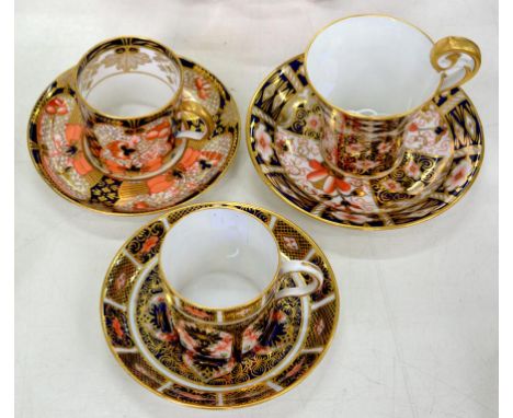THREE ROYAL CROWN DERBY COFFEE CANS AND SAUCERS, VARIOUS PATTERNS, SCROLL HANDLED CUP 8CM H, PRINTED MARK, EARLY 20TH C