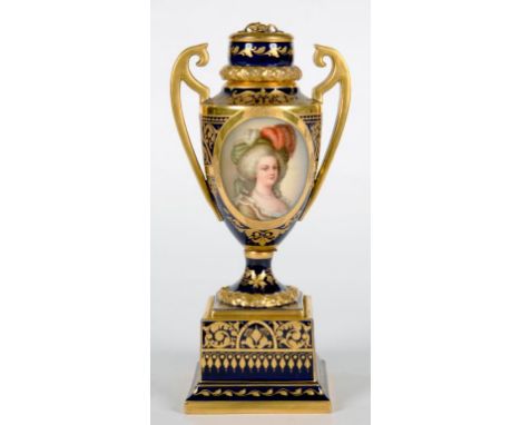 A 'VIENNA' PORCELAIN COBALT GROUND VASE AND COVER WITH UPSWEPT HANDLES, THE SHIELD SHAPED VASE PAINTED WITH A PORTRAIT OF MAR