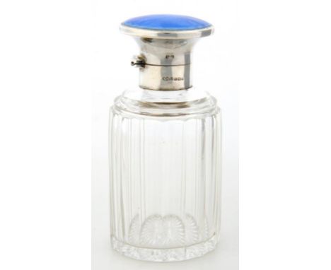 A GEORGE V SILVER MOUNTED FLUTE CUT GLASS BOTTLE WITH FLARED BLUE GUILLOCHE ENAMEL CAP, GLASS STOPPER, 12.5CM H, BIRMINGHAM 1