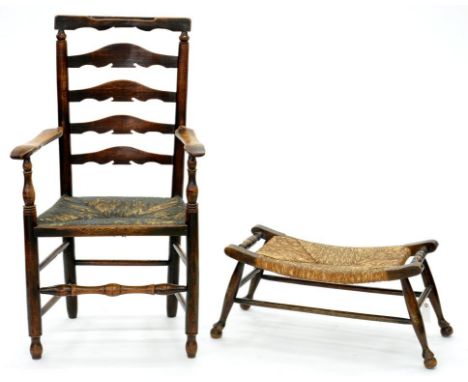 A VICTORIAN ASH LADDER BACK ELBOW CHAIR AND A BEECH FOOT STOOL, BOTH RUSH SEATED