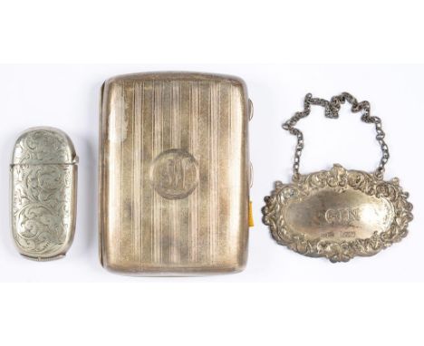 A GEORGE V SILVER CIGARETTE CASE, ENGINE TURNED, 8CM W, BIRMINGHAM 1923, A SILVER GIN DECANTER LABEL, 3OZS AND A LATE VICTORI