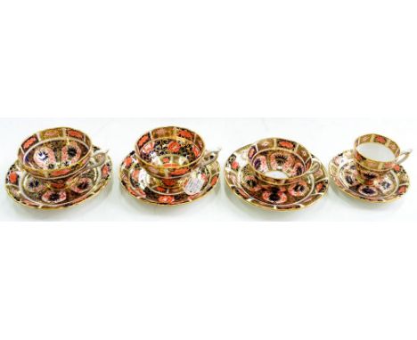 THREE ROYAL CROWN DERBY IMARI PATTERN CUPS AND SAUCERS AND AN UNUSUAL ROYAL CROWN DERBY JAPAN PATTERN PEDESTAL TEACUP AND SAU