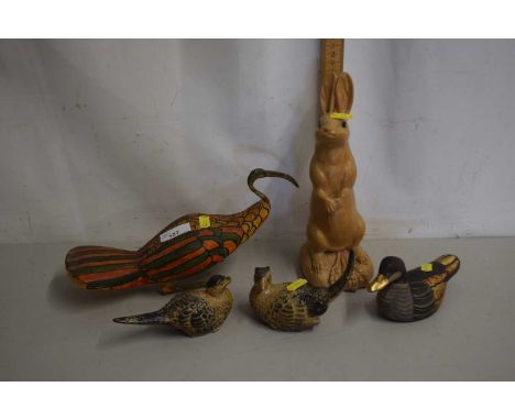 A group of ceramic and wooden animals