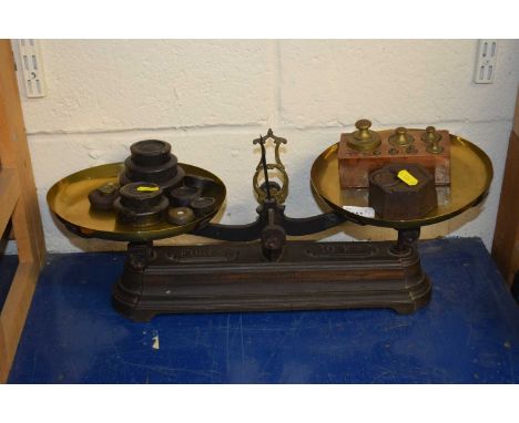 A large Victorian scale with a quantity of weights